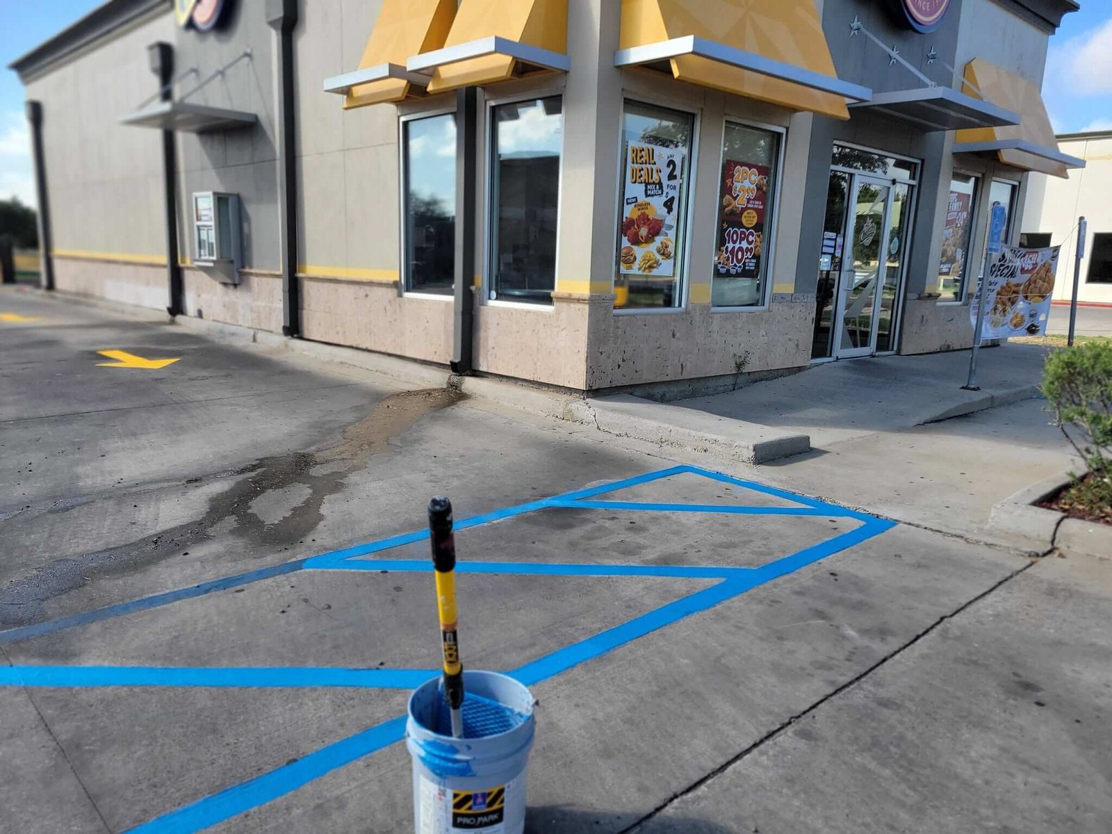 Commercial exterior painting and parking line progress