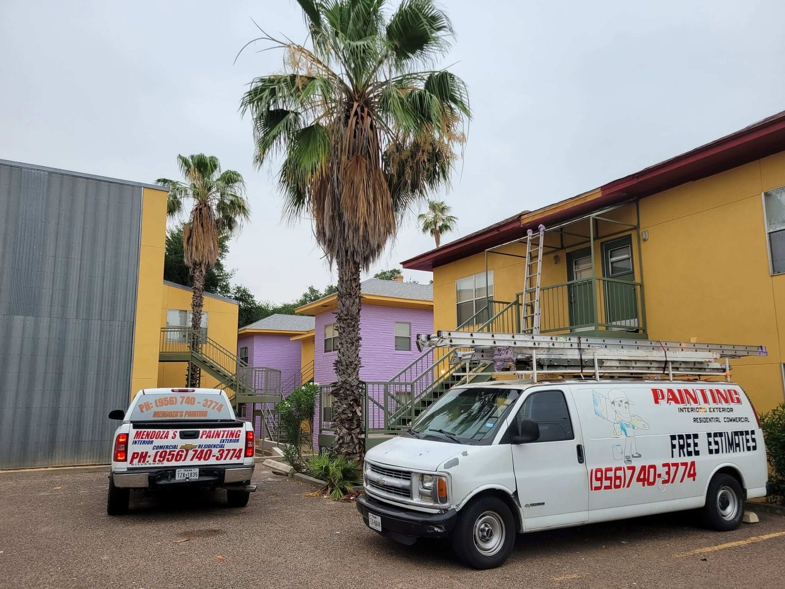 Mendoza's Painting company vehicles outside a completed commercial property